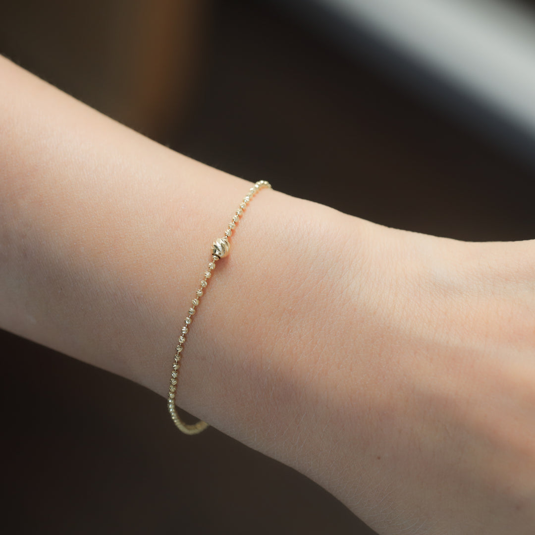 Rain-Cut Bead Bracelet with Elegant Centerpiece Sphere in 14K Gold